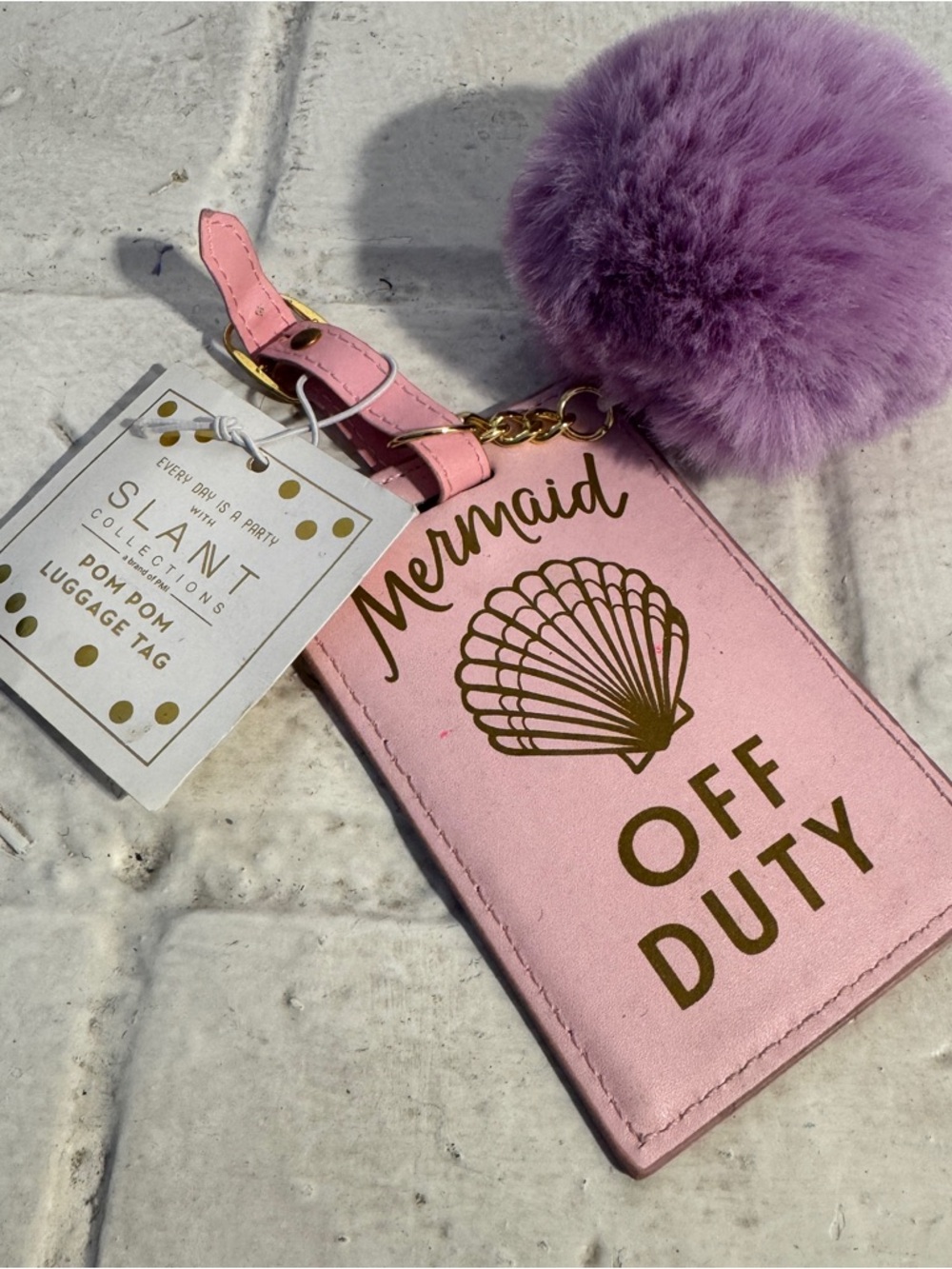 NWT pink “Mermaid Off Duty” luggage tag with purple pom pom